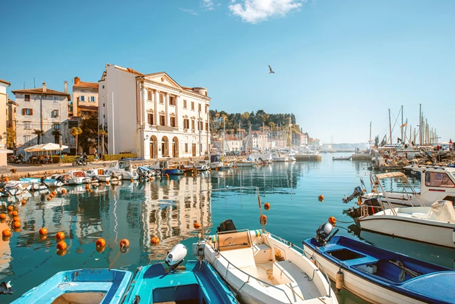 View on marina with boats and buoys in Piran town in southwestern Slovenia